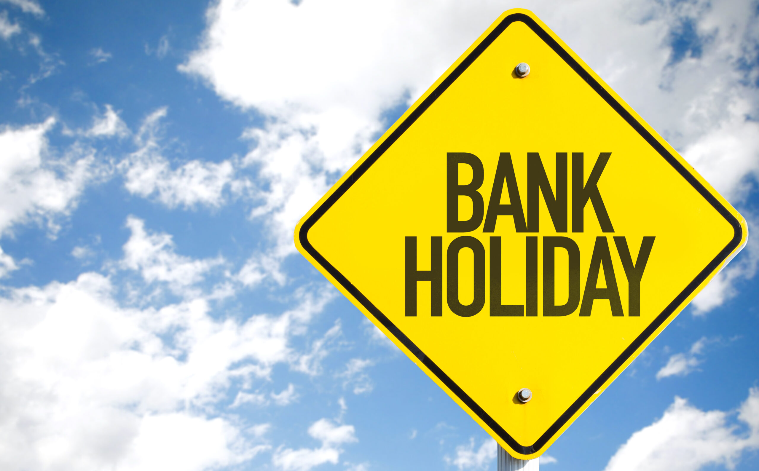 Bank,Holiday,Sign,With,Sky,Background
